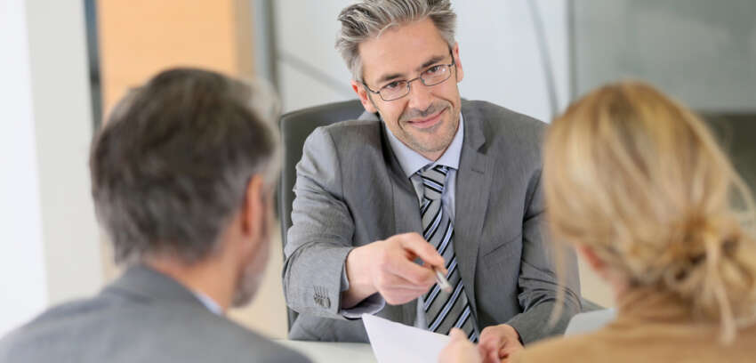 Financial planner with clients